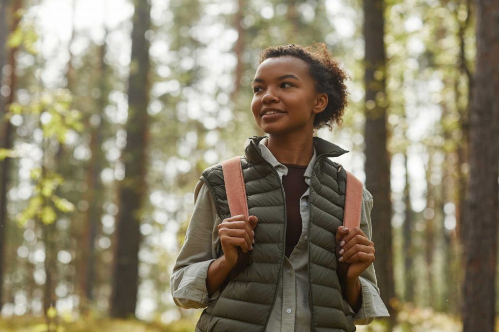 The Secret to Sustainability: Caring for Others AND Caring for Yourself 9 young woman hiking 2022 01 18 23 56 38 utc